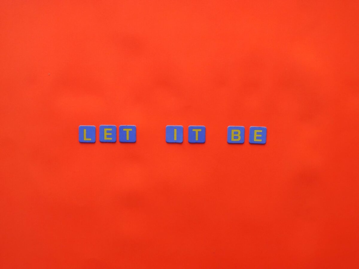 letters on tiles on orange background