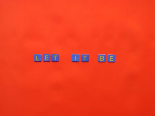 letters on tiles on orange background
